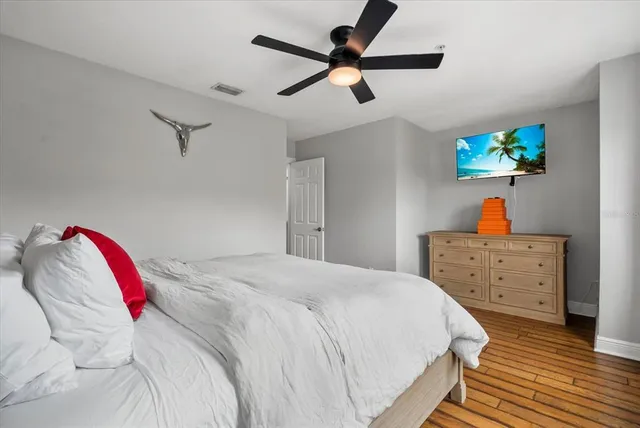 a bedroom with a bed and a dresser