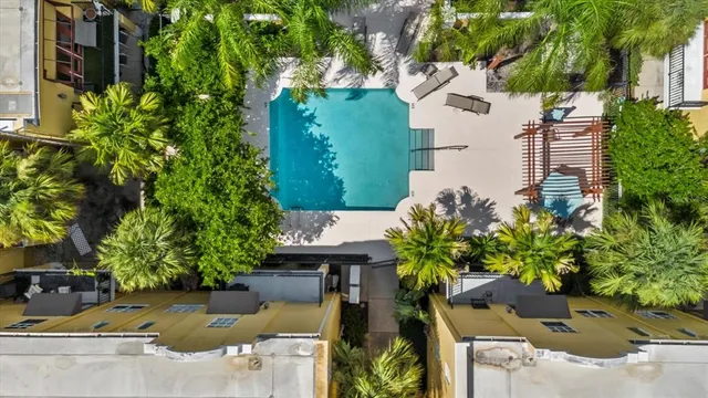 an aerial view of residential houses with outdoor space