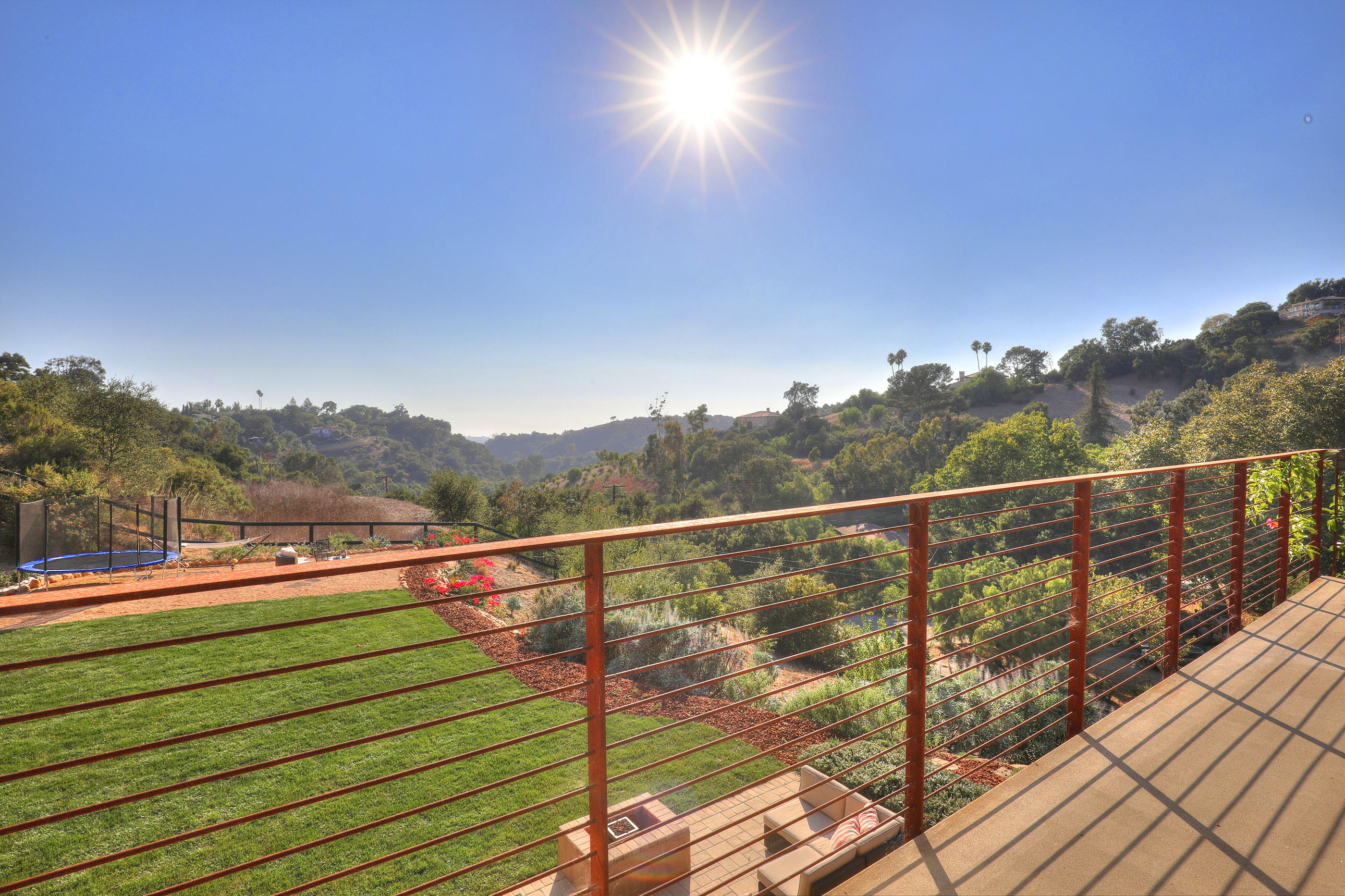 1100 Palomino Road Santa Barbara, CA 93105 - Photo 17 of 34 a view of a balcony with mountain view and wooden floor