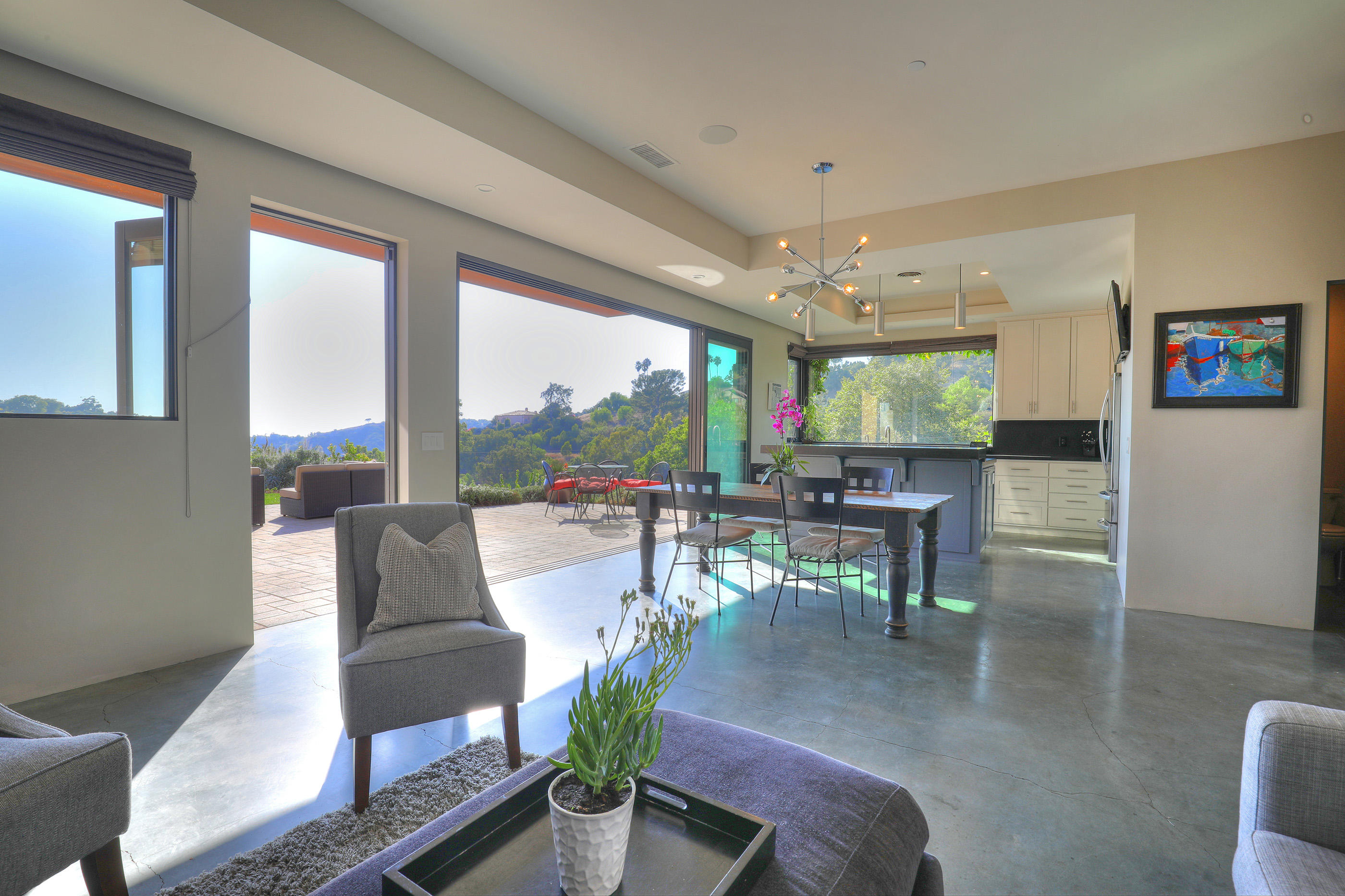 1100 Palomino Road Santa Barbara, CA 93105 - Photo 4 of 34 a living room with fireplace furniture and a large window