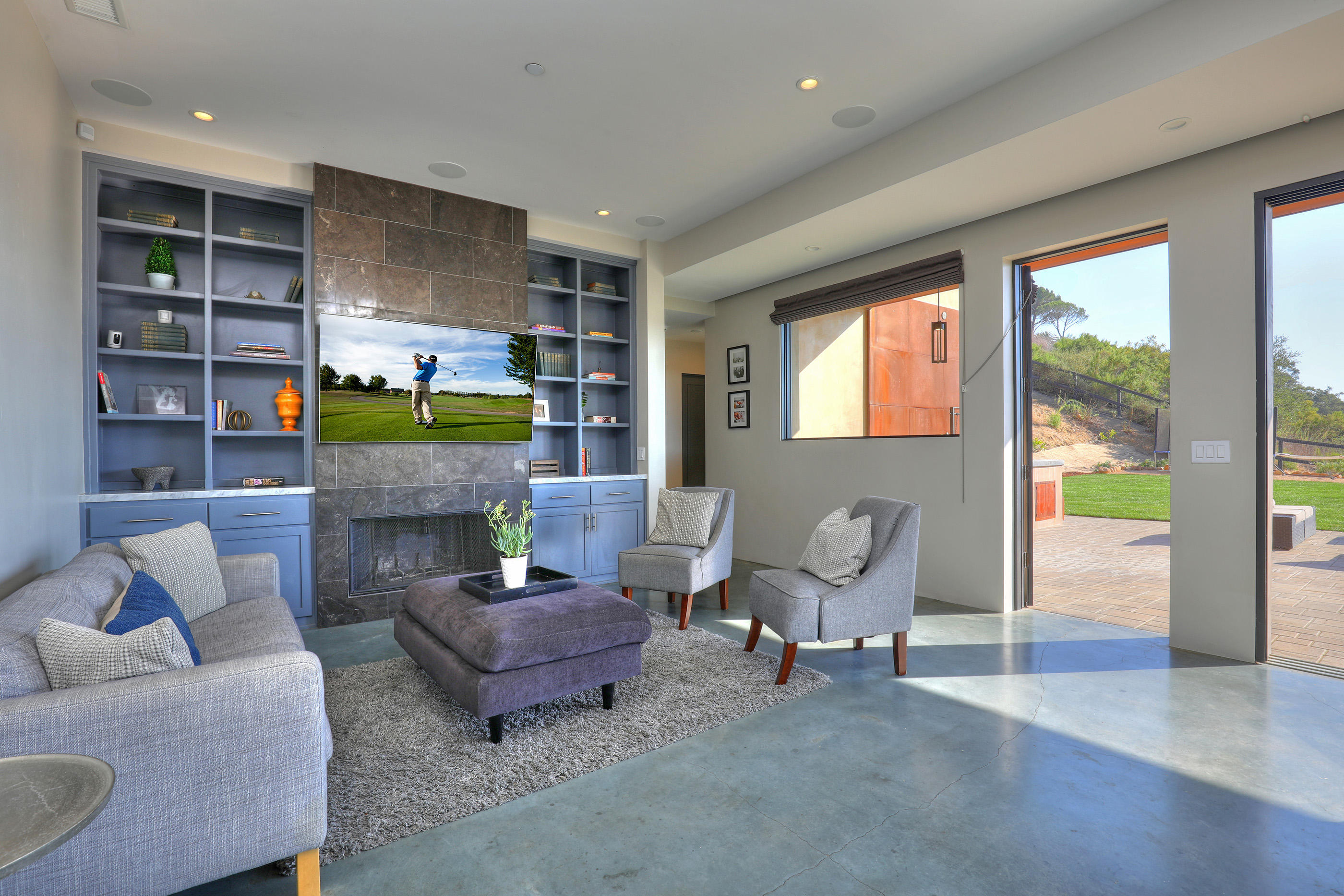 1100 Palomino Road Santa Barbara, CA 93105 - Photo 8 of 34 a living room with furniture a rug and a fireplace