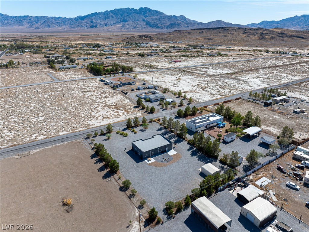 4080 Magnet Road Pahrump, NV 89048 - Photo 26 of 28 Dramatic mountain ranges frame the vast desert horizon surrounding this unique rural property.
