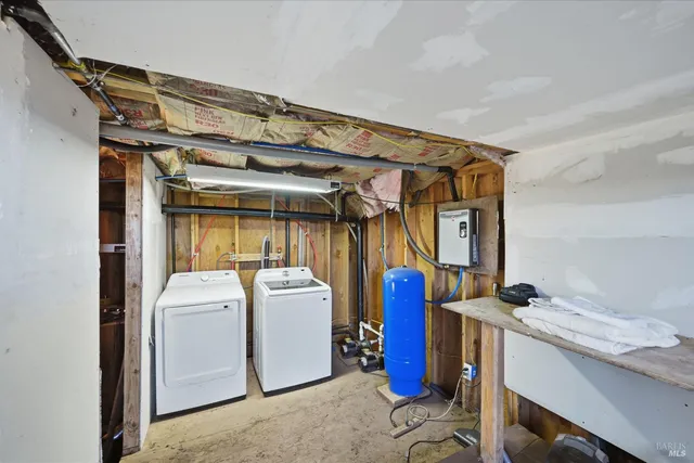 a view of a backyard with furniture and floor to ceiling window