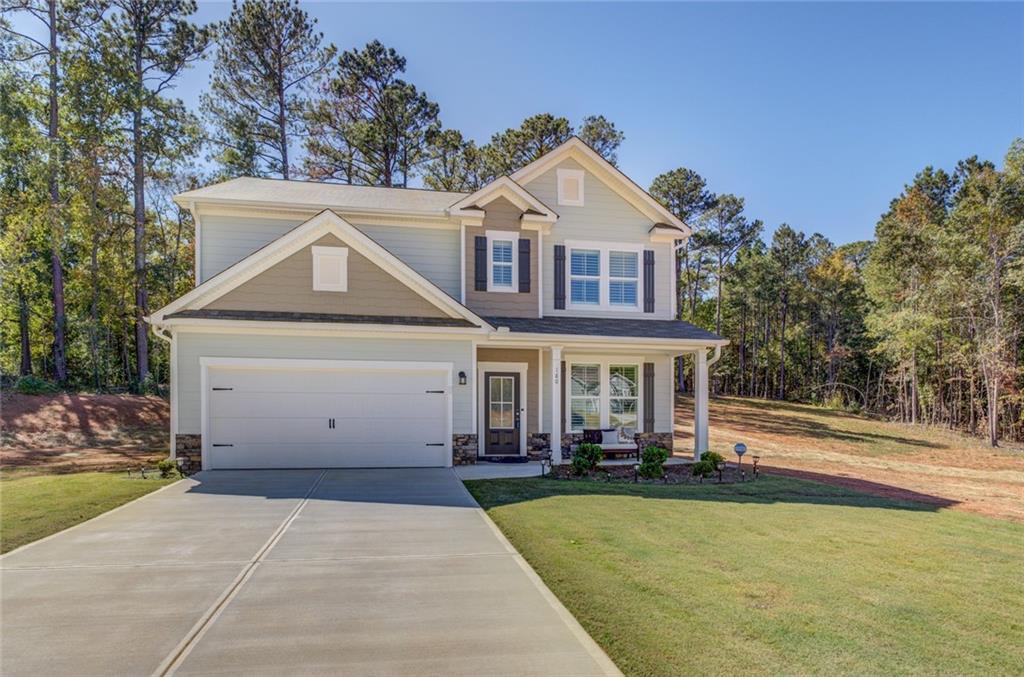 a front view of a house with a yard