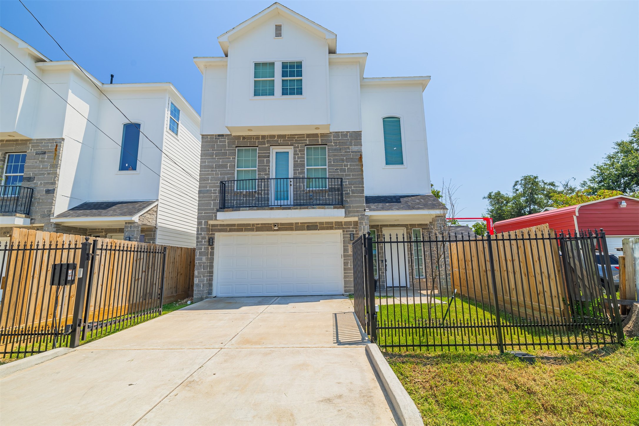 7814 De Priest Street Houston, TX 77088 - Photo 2 of 31 Gated front and back yards. Automatic driveway gate. Balcony overlooking the front yard.