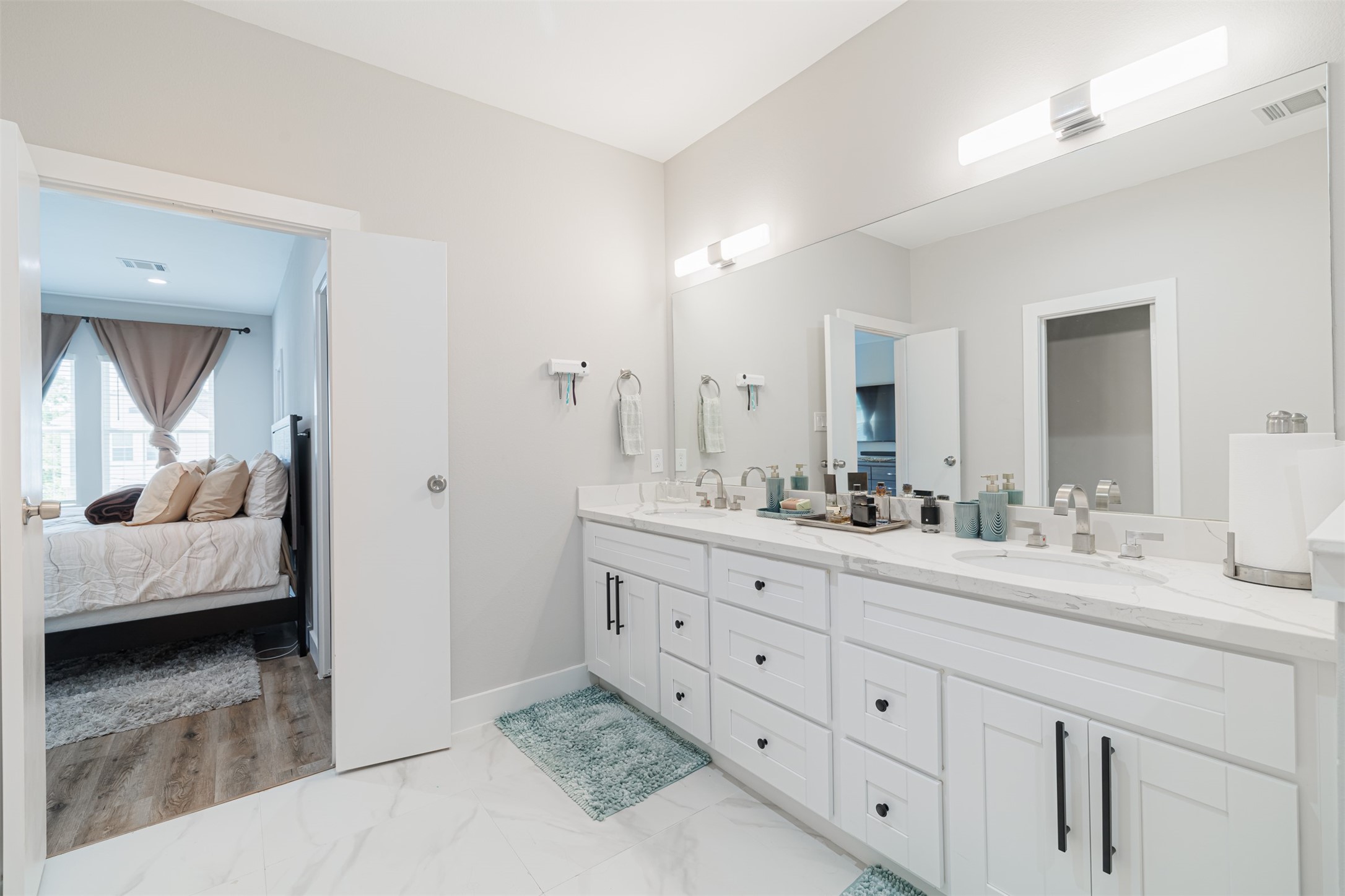 7814 De Priest Street Houston, TX 77088 - Photo 25 of 31 Another view of the primary bath looking towards the primary bedroom.