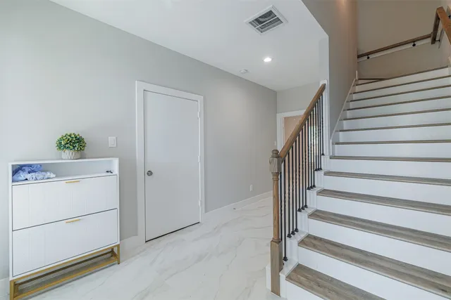 a view of entryway with stairs and furniture