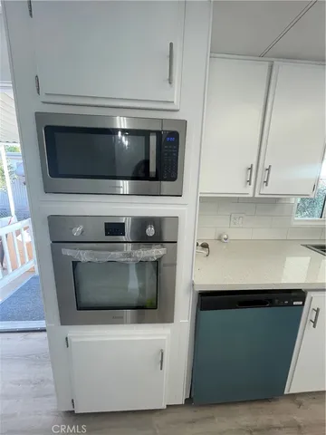 a kitchen with a stove and a microwave
