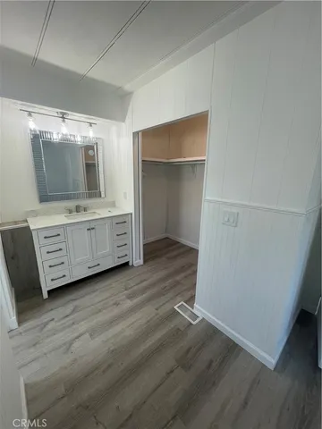 a room with a furniture and flat screen tv