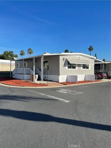 a view of building with car parked