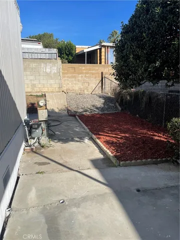 a view of a backyard with sitting area