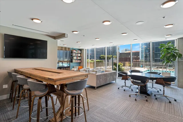 a kitchen with a table and chairs in it