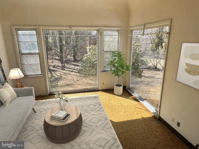 815 Pleasant Hill Road Wallingford, PA 19086 - Photo 12 of 28 a living room with furniture and a large window