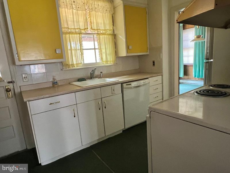 815 Pleasant Hill Road Wallingford, PA 19086 - Photo 7 of 28 a kitchen with sink cabinets and window