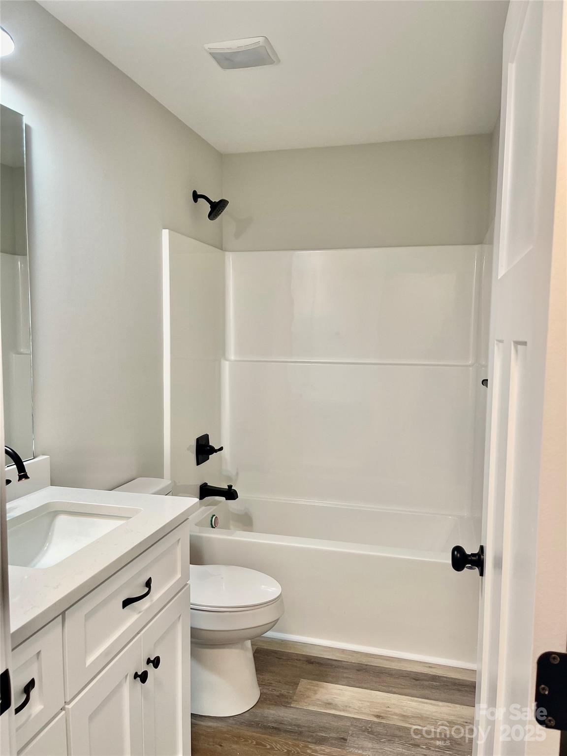 203 Prospect Church Road Albemarle, NC 28001 - Photo 30 of 44 a bathroom with a bathtub shower sink vanity and a toilet