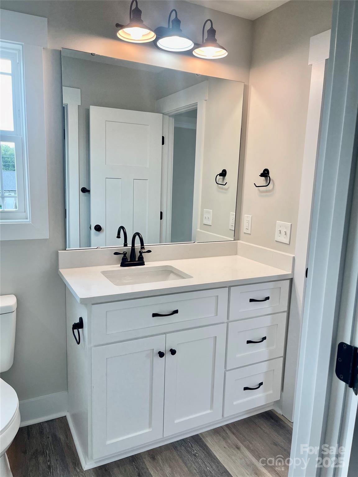 203 Prospect Church Road Albemarle, NC 28001 - Photo 37 of 44 a bathroom with a sink a toilet and a mirror