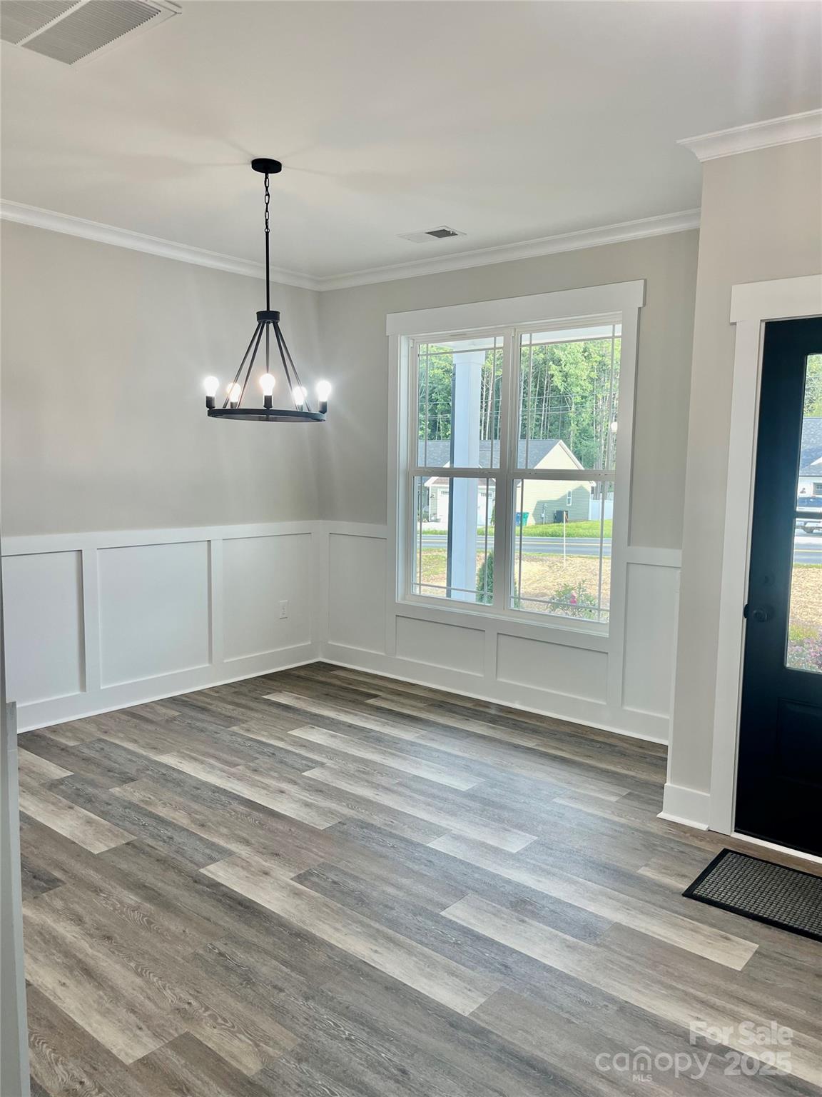 203 Prospect Church Road Albemarle, NC 28001 - Photo 4 of 44 a view of empty room with window and chandelier fan