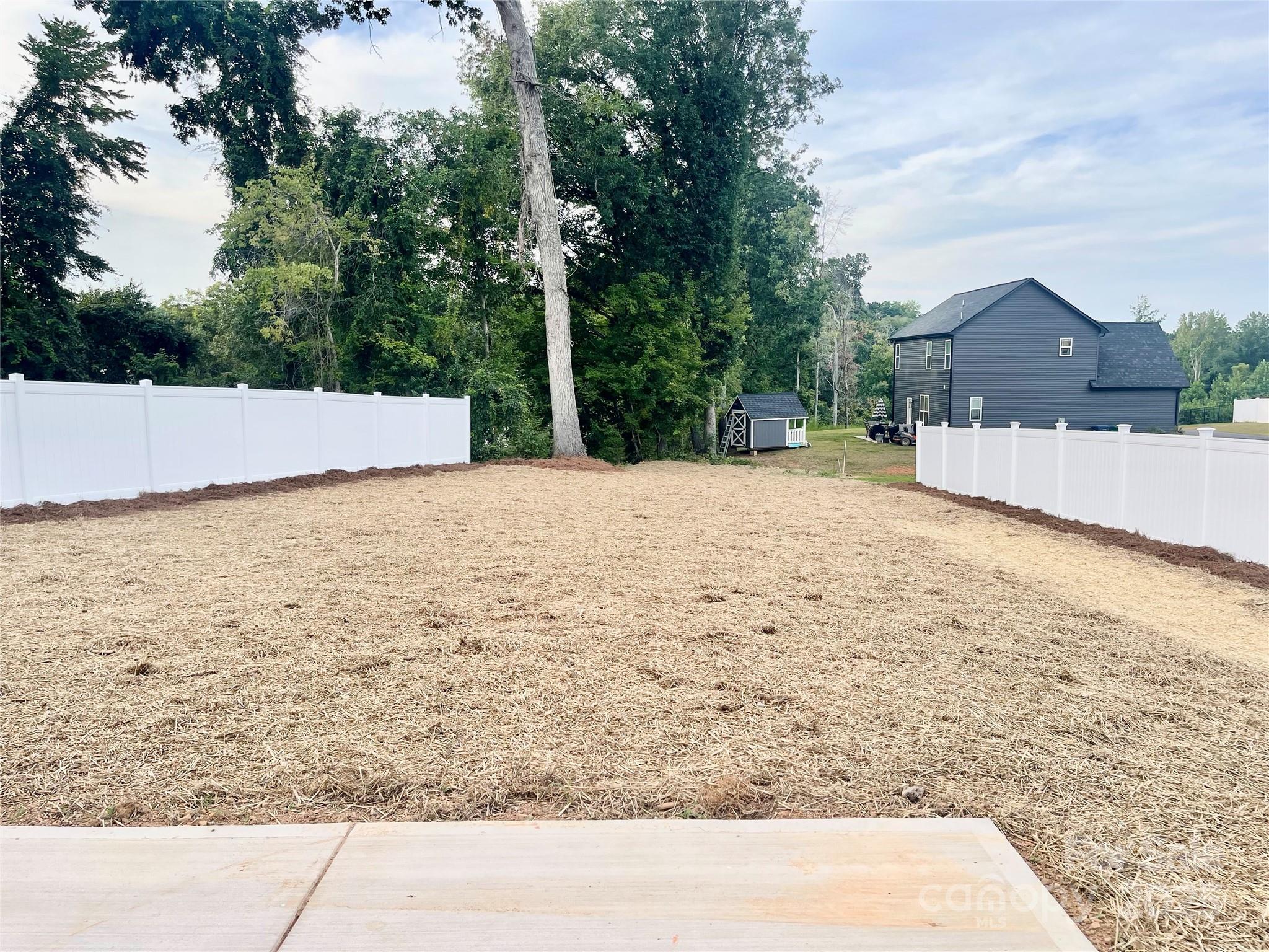 203 Prospect Church Road Albemarle, NC 28001 - Photo 41 of 44 a view of wooden fence and large trees