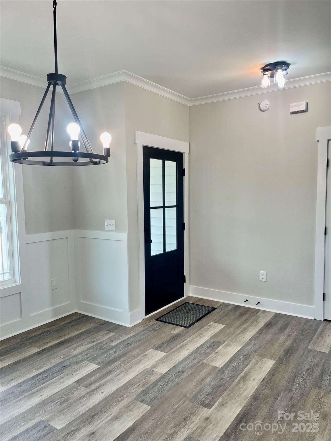203 Prospect Church Road Albemarle, NC 28001 - Photo 5 of 44 a view of an empty room with wooden floor and a window