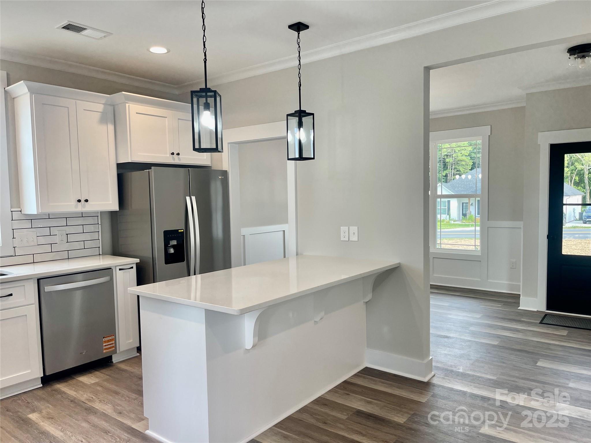 203 Prospect Church Road Albemarle, NC 28001 - Photo 8 of 44 a kitchen with stainless steel appliances kitchen island a refrigerator sink and cabinets