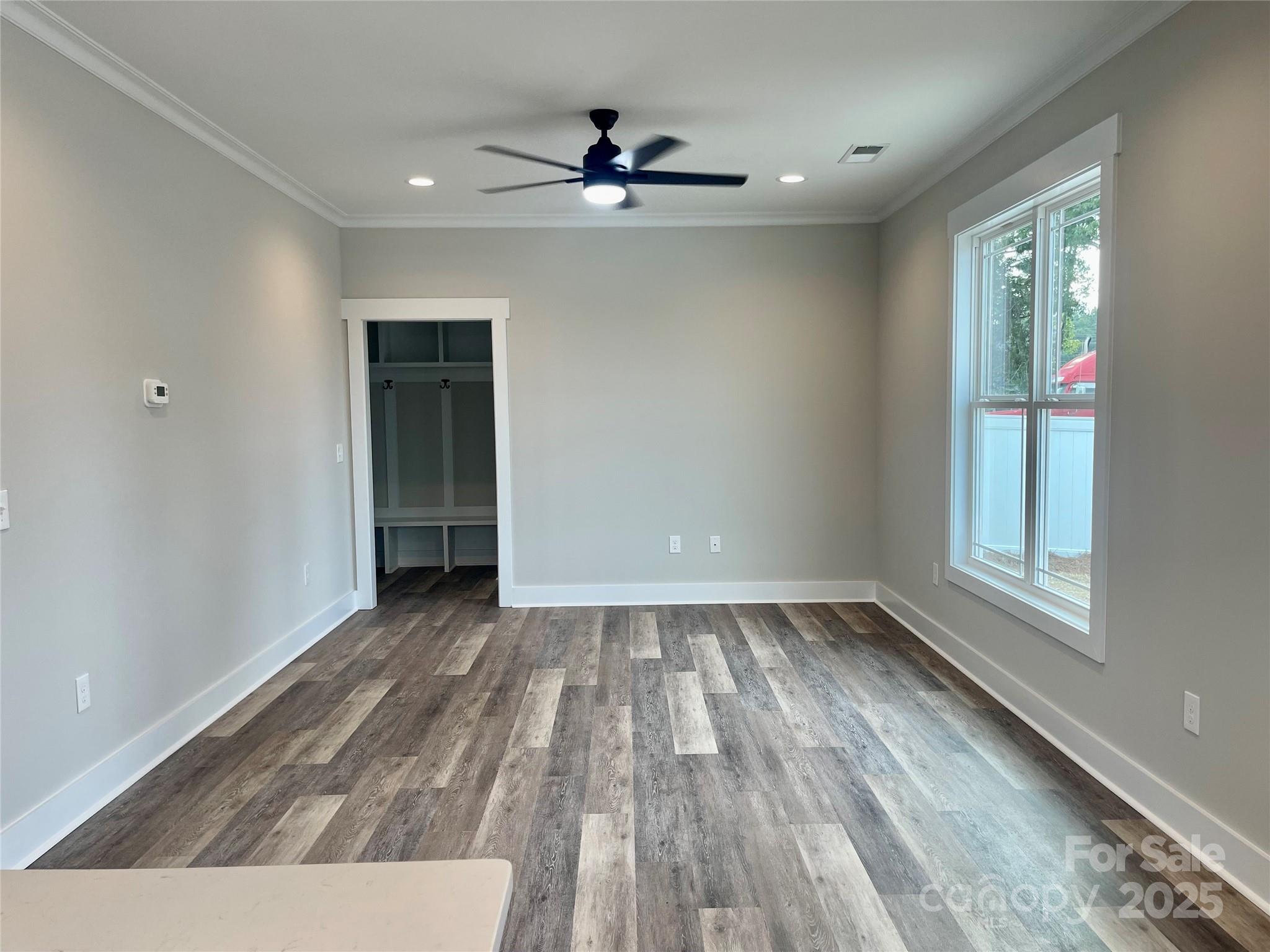 203 Prospect Church Road Albemarle, NC 28001 - Photo 10 of 44 wooden floor in an empty room with a window