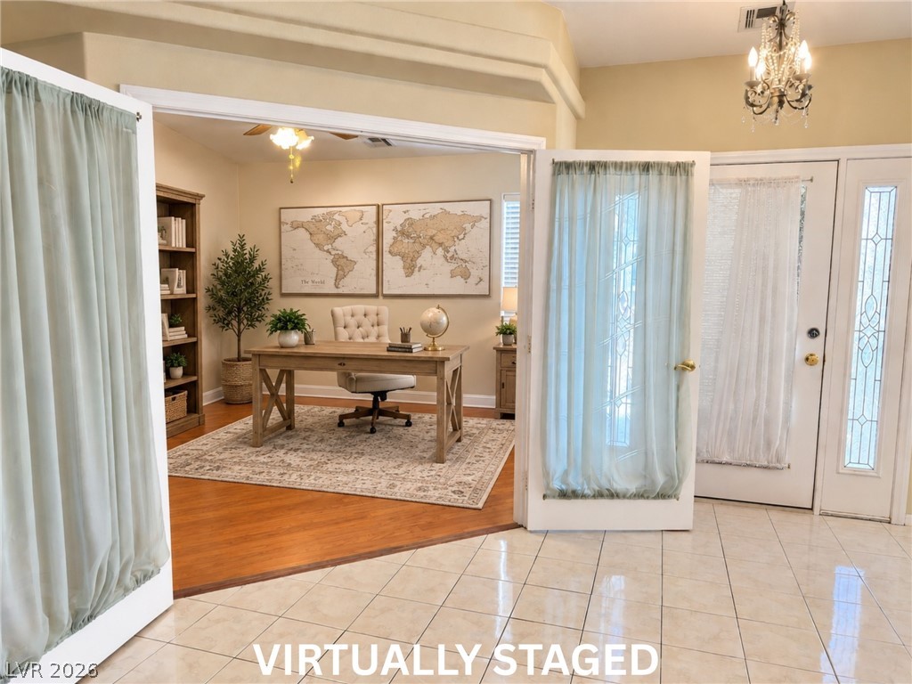 5470 Grain Mill Road Pahrump, NV 89061 - Photo 6 of 80 VIRTUALLY STAGED Double doors open from the tiled foyer into a private study with warm wood flooring. This 11x11 room can be used as a bedroom, office, hobby room, playroom, or whatever you desire.