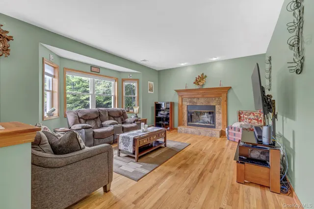 a kitchen with a table chairs and refrigerator