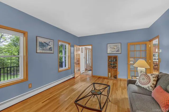 a view of a dining room with furniture window and wooden floor
