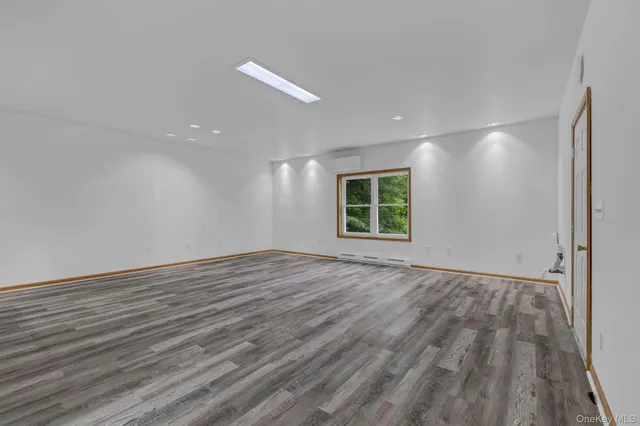 a bathroom with a sink a mirror and a shower