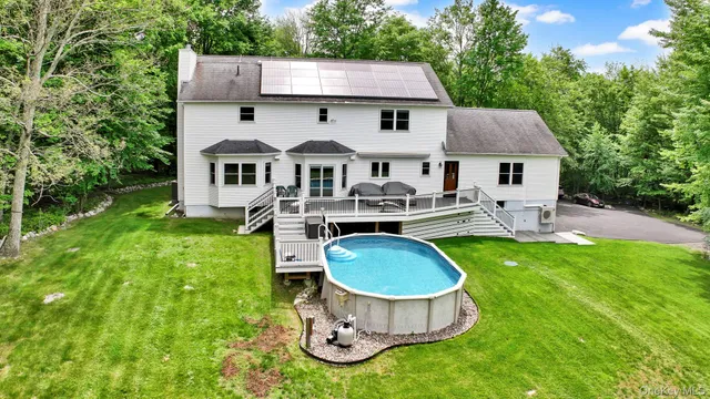 a front view of house with a garden and patio