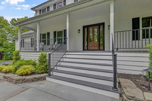 a view of a house with a window and stairs
