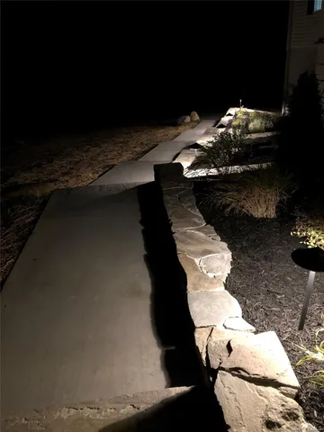 a view of a backyard of chairs and a table