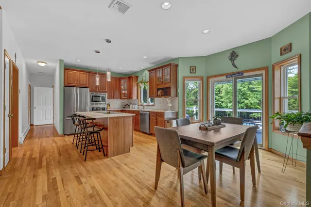 a view of a dining room with furniture window and outside view