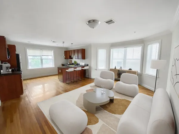 a living room with furniture fireplace and a flat screen tv