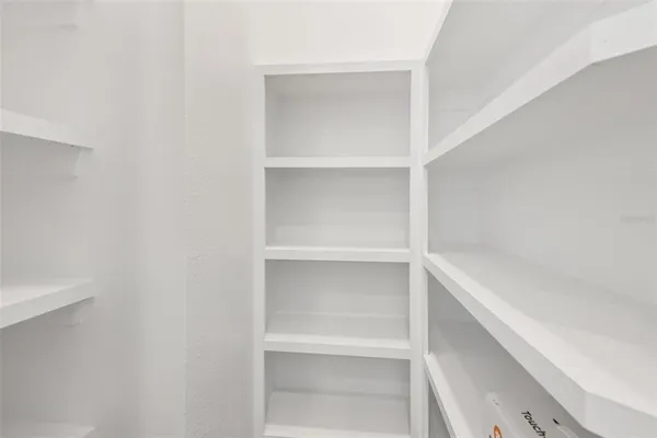 a view of an empty walk in closet