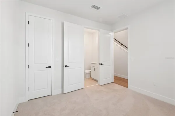 a bathroom with a toilet sink and shower