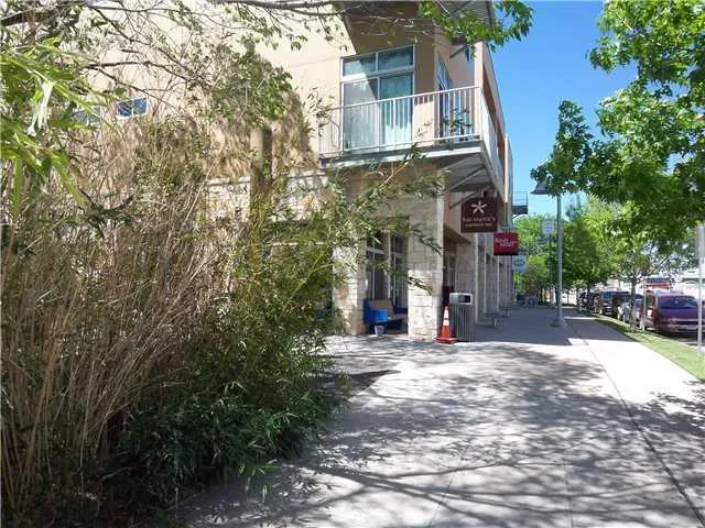 front view of a building with a yard