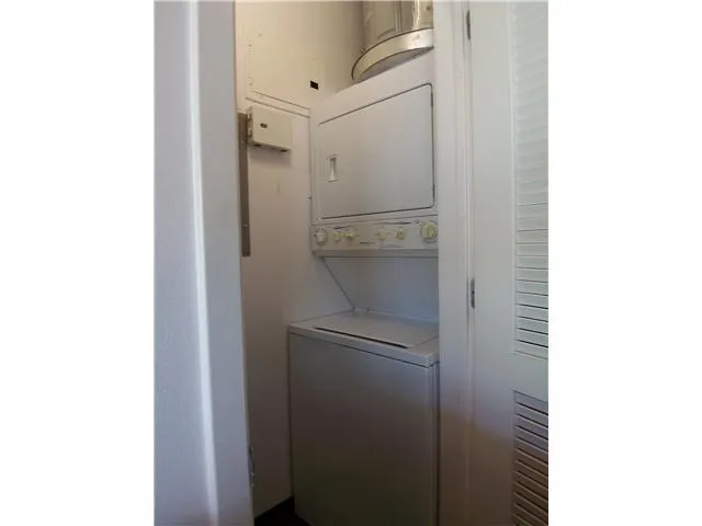 a bathroom with a shower and a sink