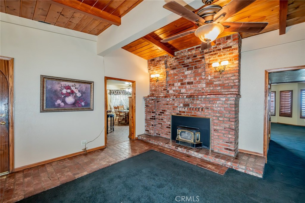 3230 Silver Ridge Drive Pinon Hills, CA 92372 - Photo 15 of 49 a living room with furniture and a fireplace