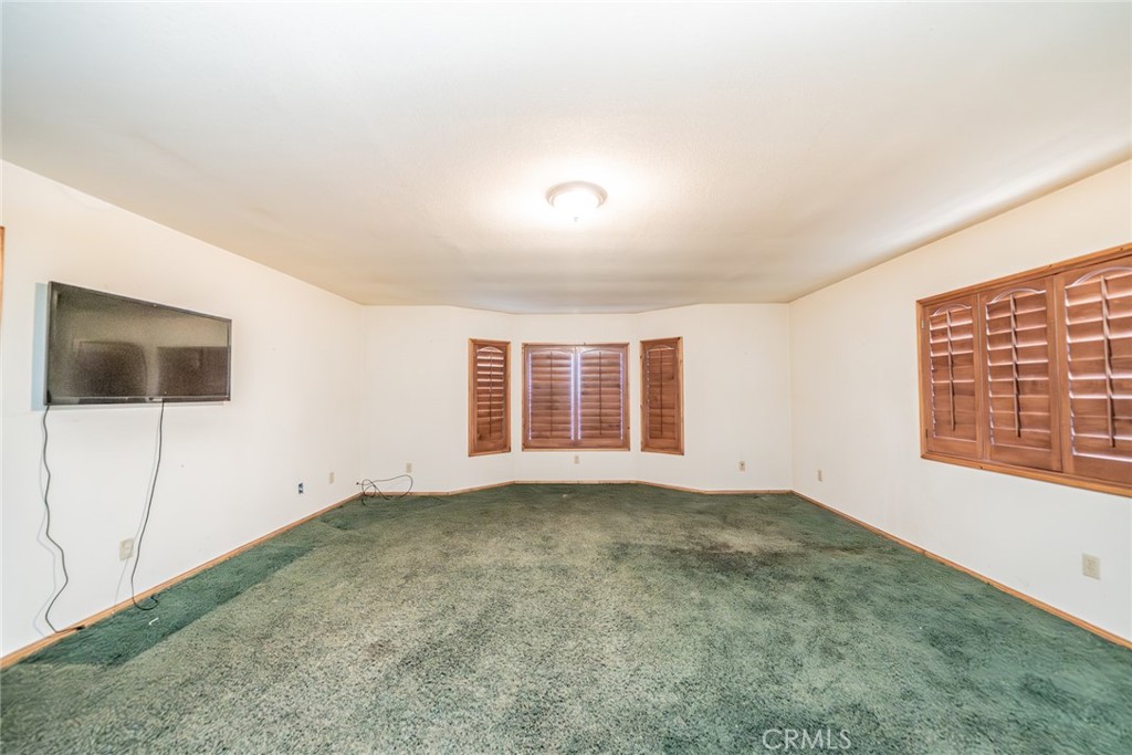 3230 Silver Ridge Drive Pinon Hills, CA 92372 - Photo 19 of 49 an empty room with windows