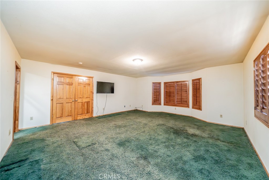 3230 Silver Ridge Drive Pinon Hills, CA 92372 - Photo 20 of 49 an empty room with windows