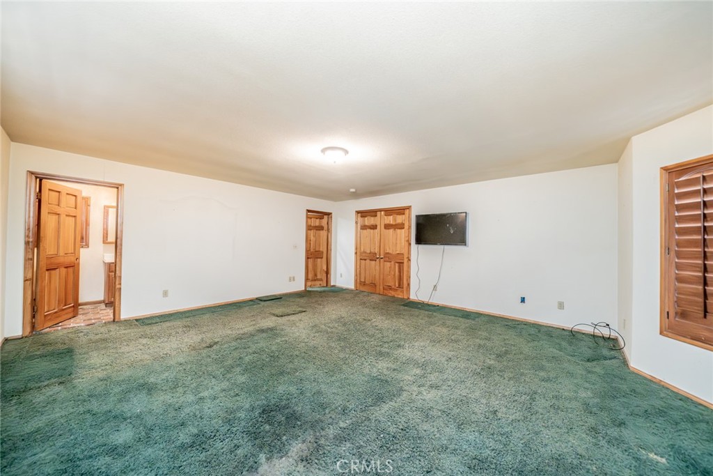 3230 Silver Ridge Drive Pinon Hills, CA 92372 - Photo 21 of 49 an empty room with windows