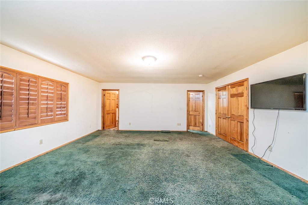 3230 Silver Ridge Drive Pinon Hills, CA 92372 - Photo 22 of 49 a view of an empty room with a window