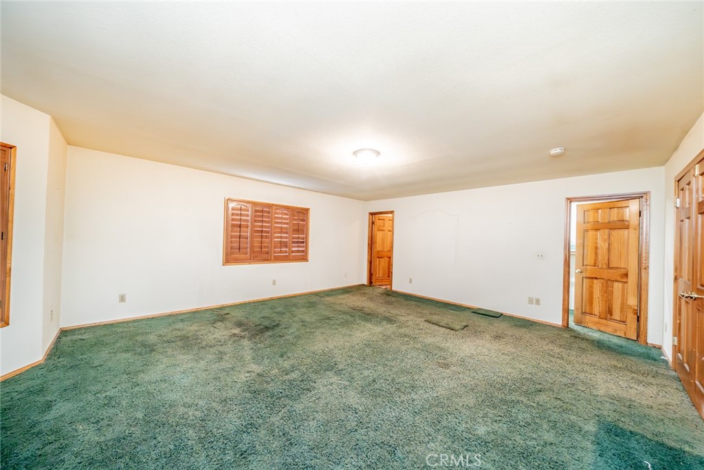 3230 Silver Ridge Drive Pinon Hills, CA 92372 - Photo 23 of 49 an empty room with windows