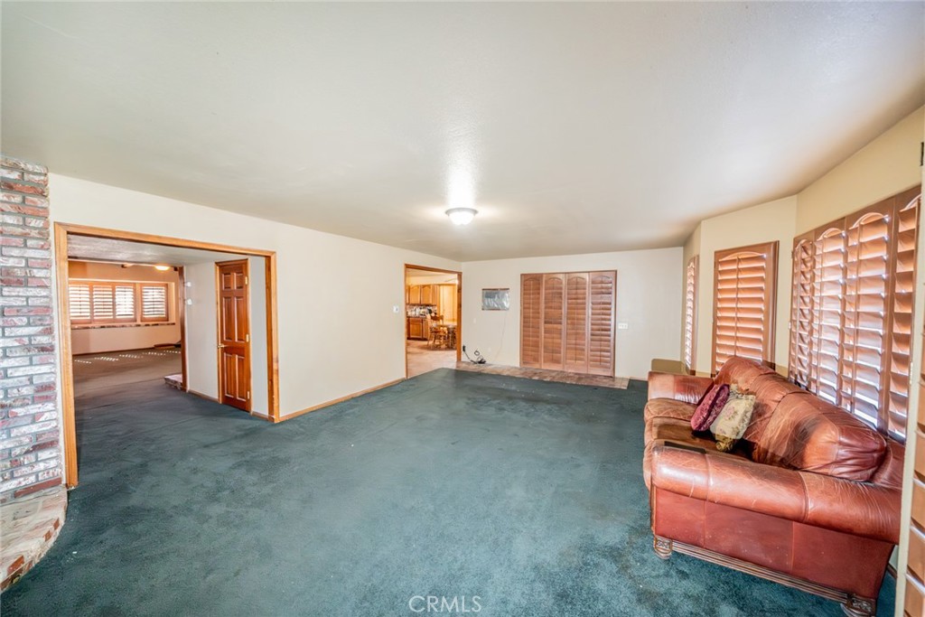 3230 Silver Ridge Drive Pinon Hills, CA 92372 - Photo 25 of 49 a living room with furniture and a window