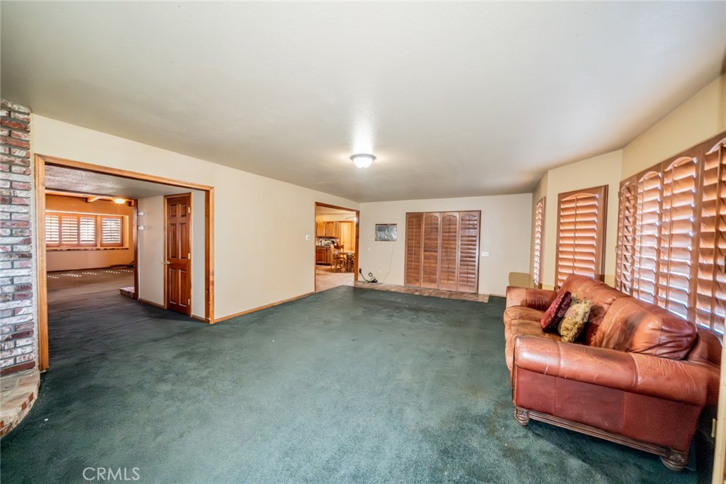 3230 Silver Ridge Drive Pinon Hills, CA 92372 - Photo 26 of 49 a living room with furniture and a window