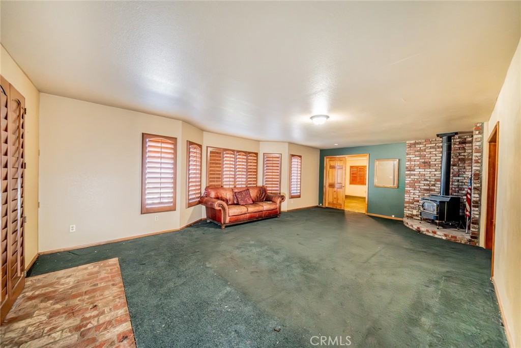 3230 Silver Ridge Drive Pinon Hills, CA 92372 - Photo 30 of 49 a view of a livingroom with couch and a window