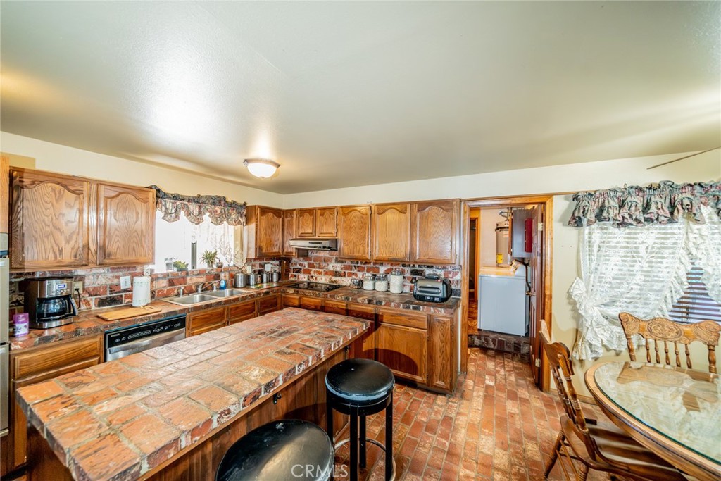 3230 Silver Ridge Drive Pinon Hills, CA 92372 - Photo 33 of 49 a room with lots of furniture and a large window