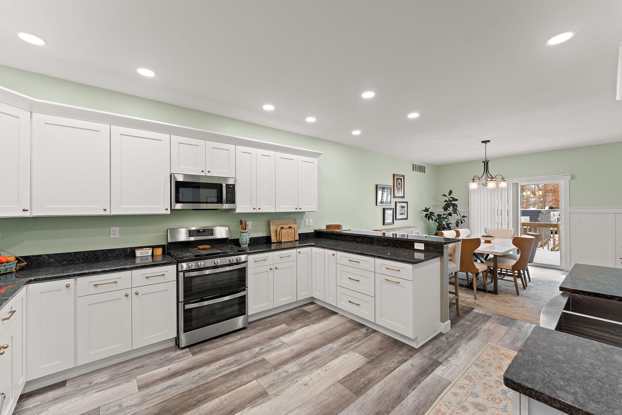 4200 Cardinal Lane Valparaiso, IN 46383 - Photo 14 of 44 a kitchen with stainless steel appliances kitchen island granite countertop a sink and cabinets