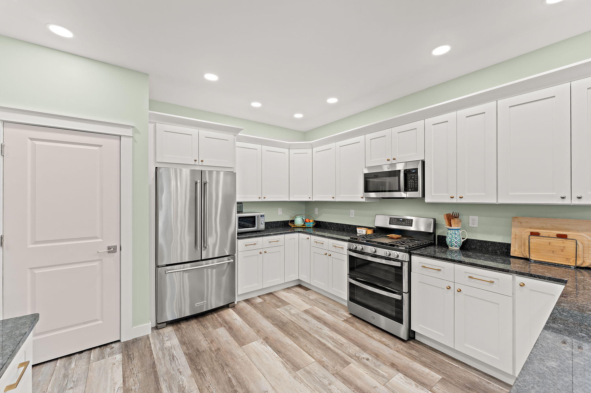 4200 Cardinal Lane Valparaiso, IN 46383 - Photo 15 of 44 a kitchen with white cabinets and stainless steel appliances